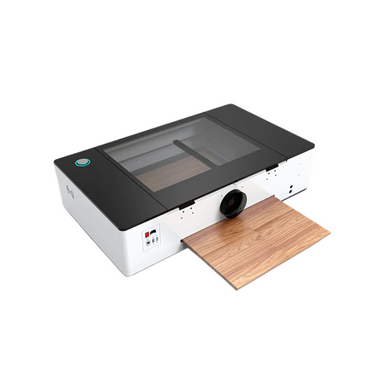 gweike cloud CO2 laser cutter and engraver from top left side view with light brown wood on the lower feeding tray
