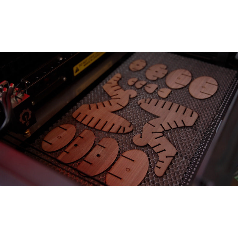 close up view of various wooden shapes created by emblaser pro 60 watt laser cutter
