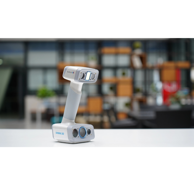 shining 3d einscan h2 scanner on a white table from front left side view with a blurred background