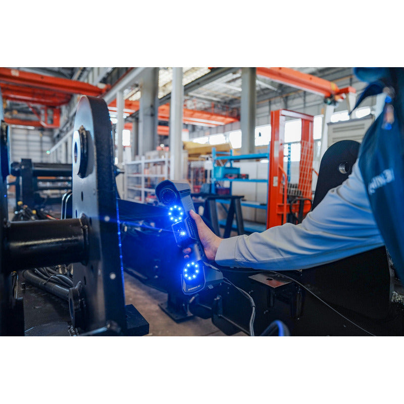 free scan trio laser 3d scanner in use with blue laser lights facing the front from a right angle view