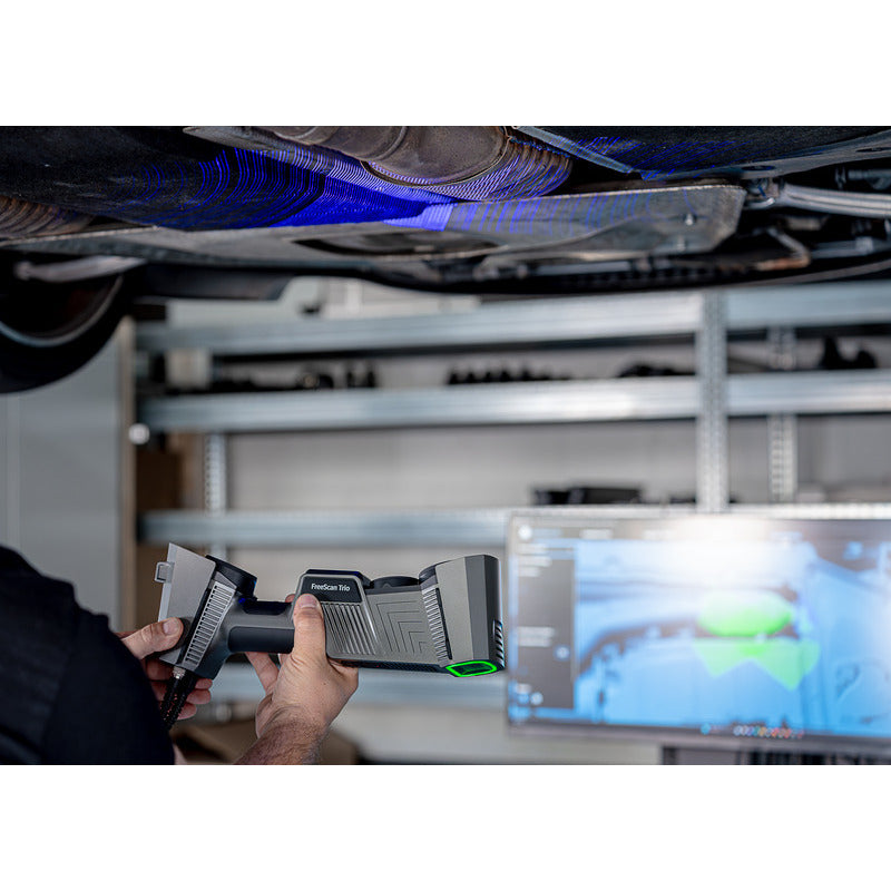 free scan trio laser 3d scanner in hand held use horizontally facing upwards scanning the bottom of a car