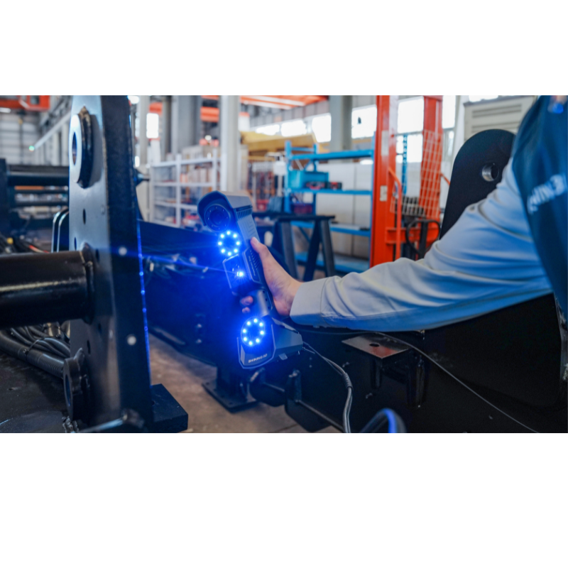 freescan trio laser 3d scanner pointed at right side of metal structure in an industrial setting 