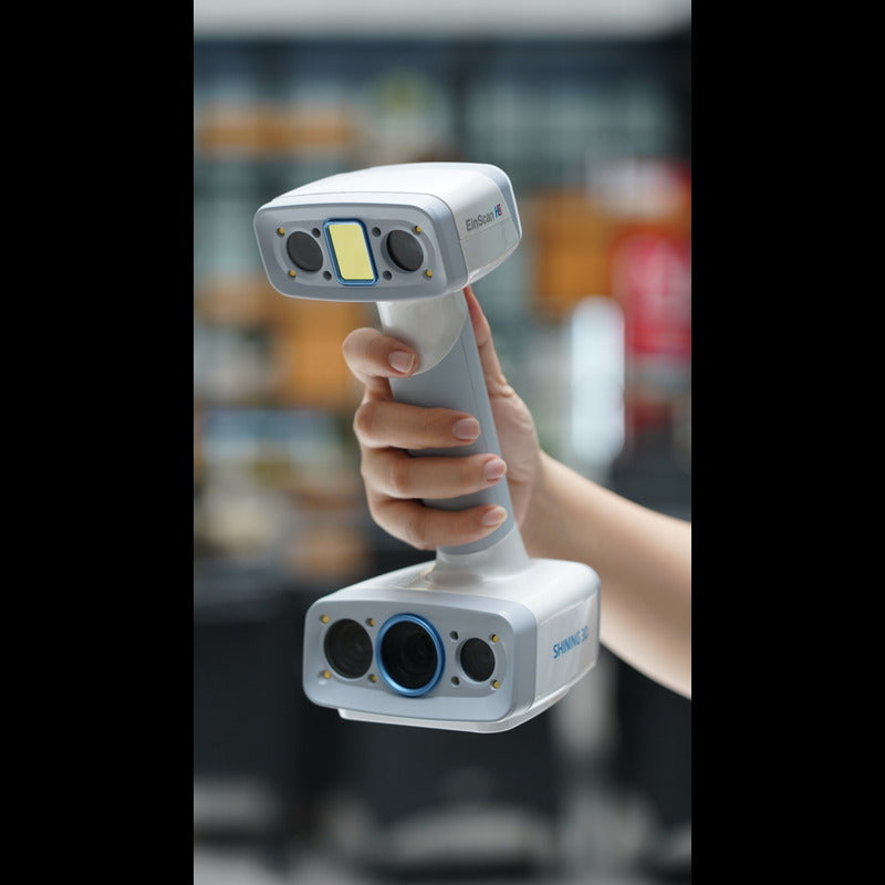 shining 3d einscan h2 scanner held by a hand from a front right angle view