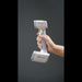 hand holding a shining 3d einscan h2 scanner from a right side view