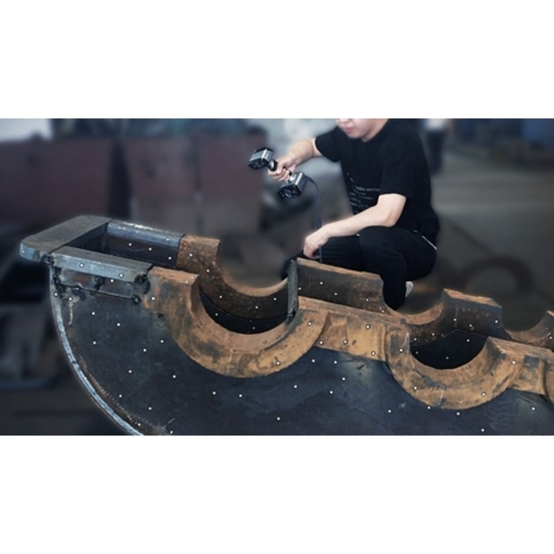 shining 3d einscan hx scanner scanning a large metal object by a person