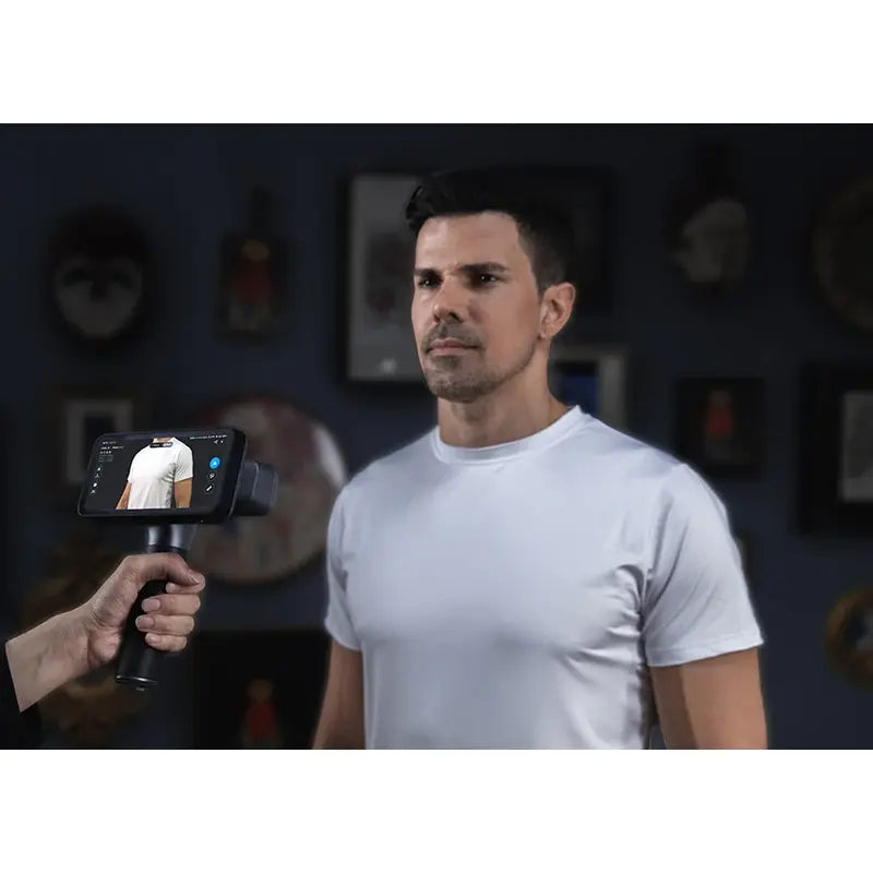 shining 3d einscan rigil is used to scan person wearing a white t shirt with output displayed on the screen