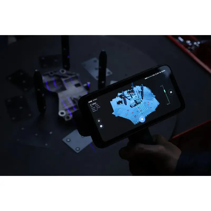 shining 3d einscan rigil wireless laser scanner displays car mechanical model with various metal plates and components in the background