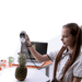 young girl scans a pineapple on the table using a shining 3d einstar scanner with a laptop displaying data output besides her