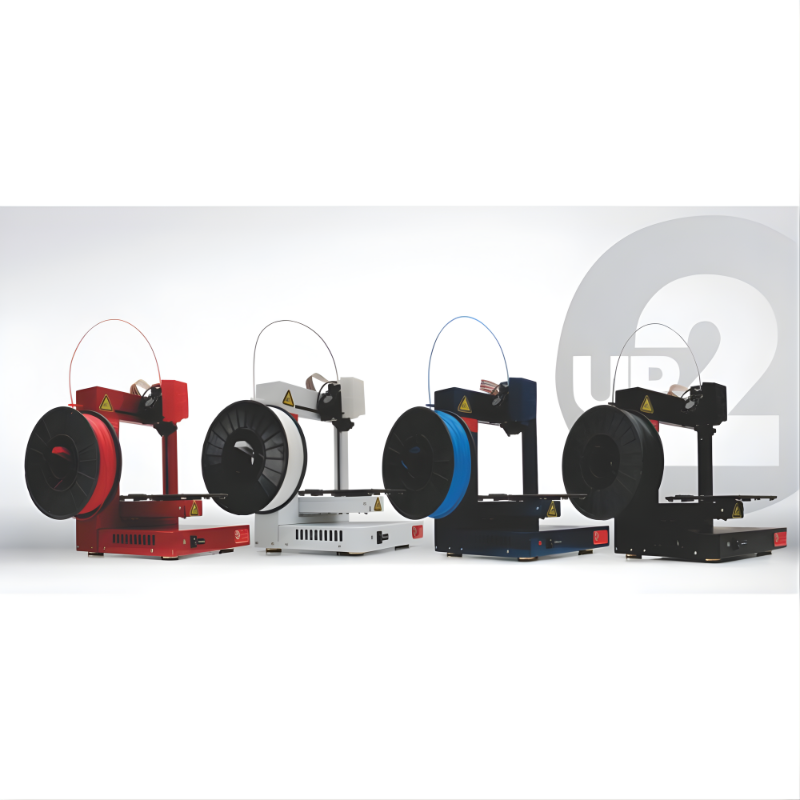 four tiertime up plus 2 3d printers in red, white, blue, and black displayed side by side
