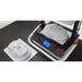 high angle view of vaquform dt2 digital desktop vacuum former machine in operation producing masks
