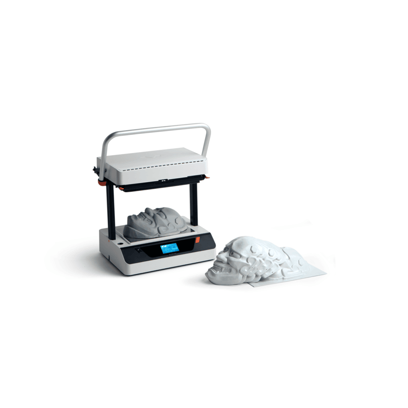 isometric view of the vaquform dt2 digital desktop vacuum former machine in operation producing masks