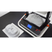 high angle view of vaquform dt2 vacuum forming machine in operation producing masks